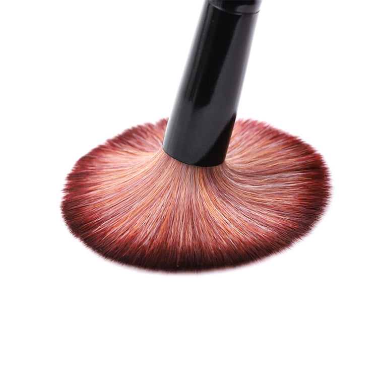 Round nail dusting brush with soft burgundy bristles and black base