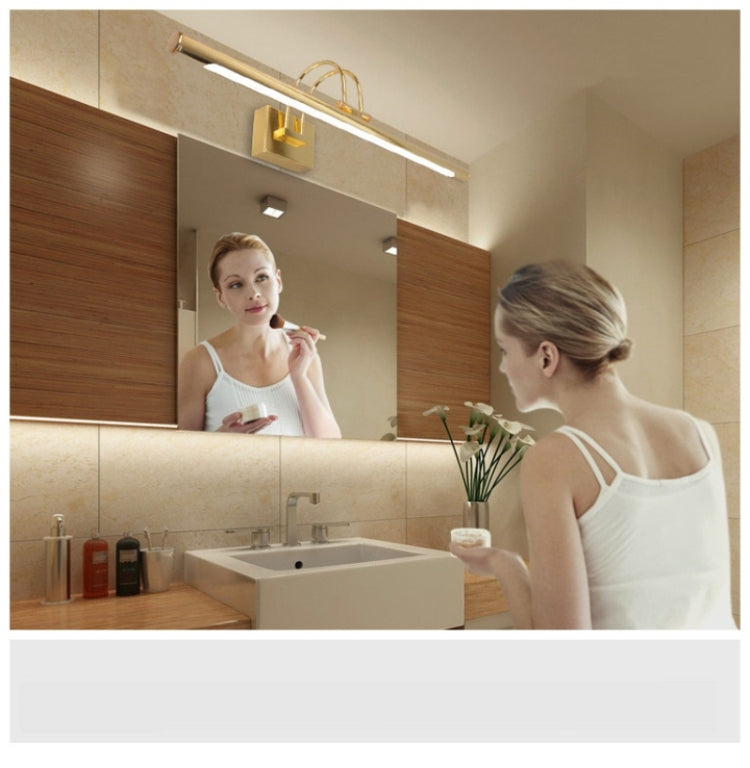 Gold LED bathroom wall light above mirror for grooming and washing