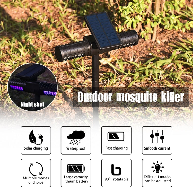 Solar mosquito killer light with solar panel and purple UV LEDs on outdoor ground