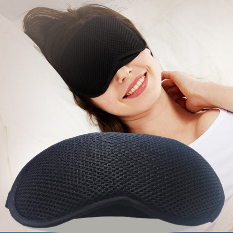 Woman lying down with a black contoured sleep eye mask covering the eyes