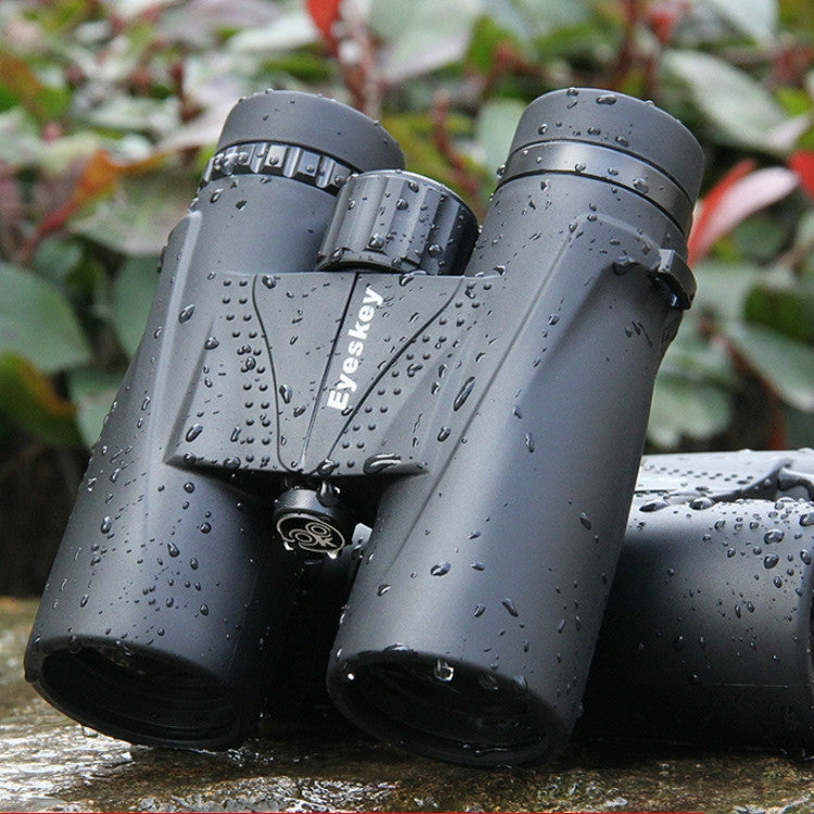 Grey waterproof binoculars with raindrops, black eyecups, wet grip