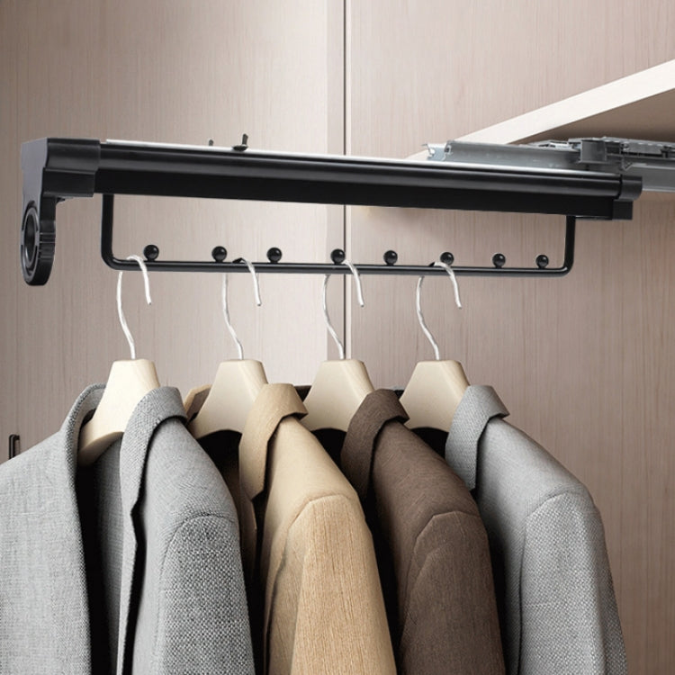 Black telescopic hanging rod with multiple garment hooks and hangers