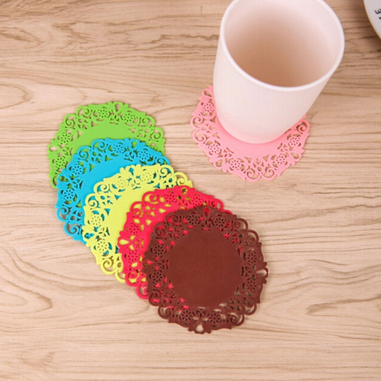 Colorful lace-flower silicone cup coasters with cups nearby