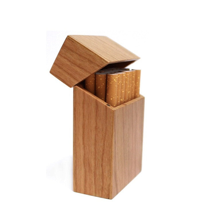 Light wood clamshell cigarette case with hinged lid and cigarettes visible inside
