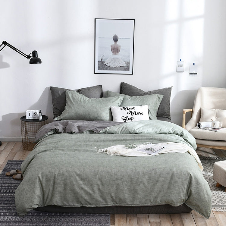 Solid gray-green comforter and pillowcases bedding set on bed