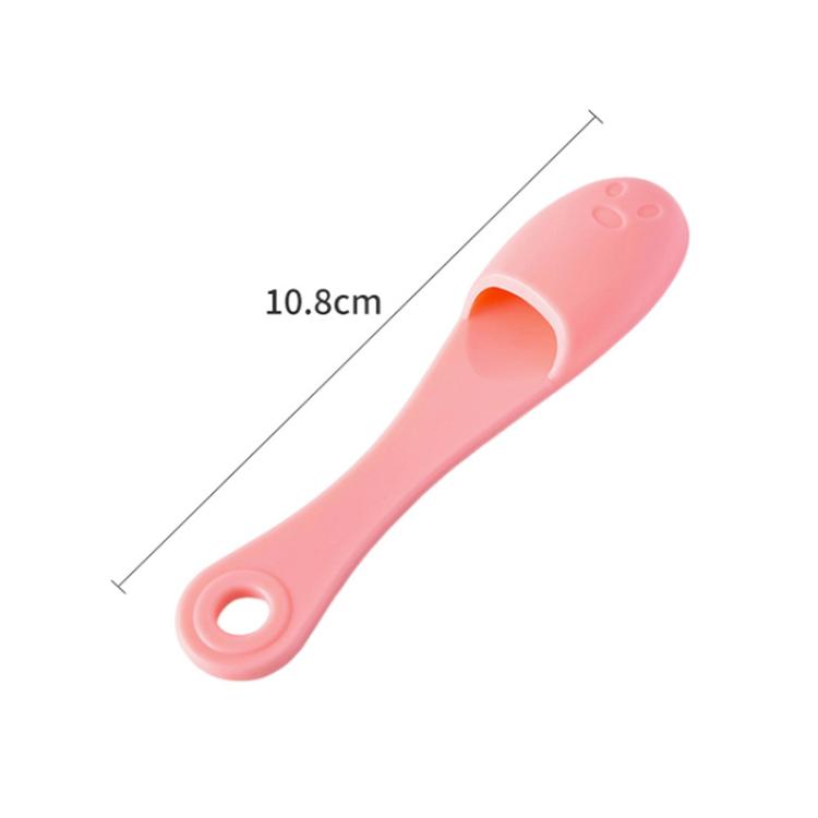 Pink silicone face cleansing brush handle with finger loop opening, 10.8 cm