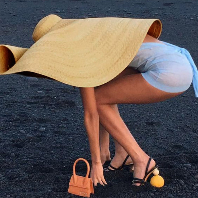 Side view woven straw sun hat with oversized wide brim, beige
