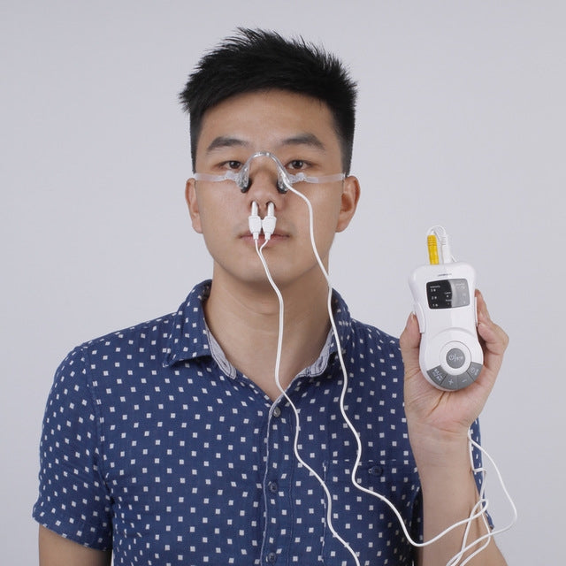 Laser device held in hand with nose clip applicator connected by cables