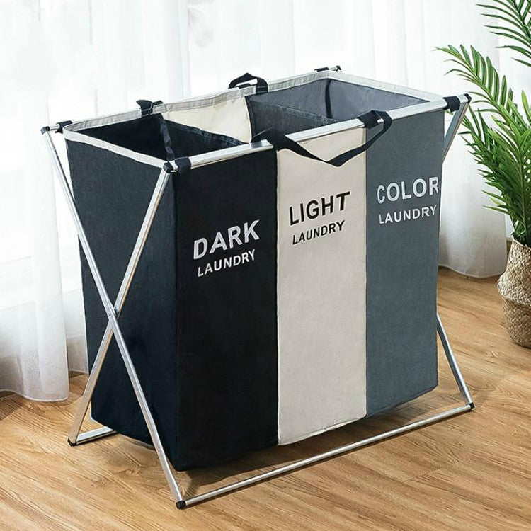 Folding laundry hamper with three compartments, black, light beige, and gray fabric basket