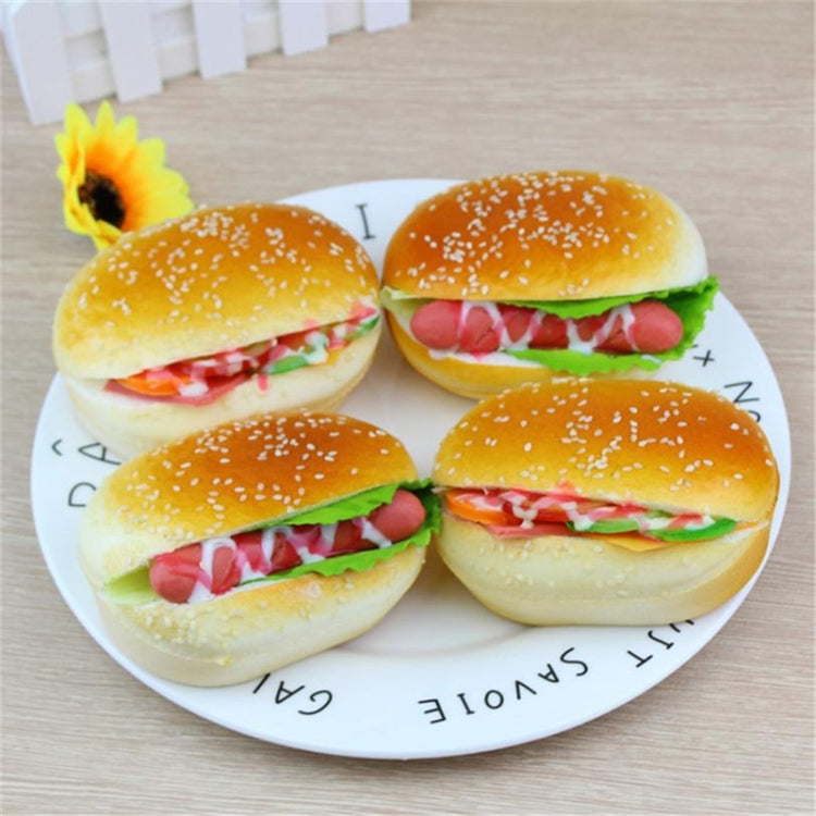 Set of four hamburger squishy toys with sesame buns, green lettuce, and red filling