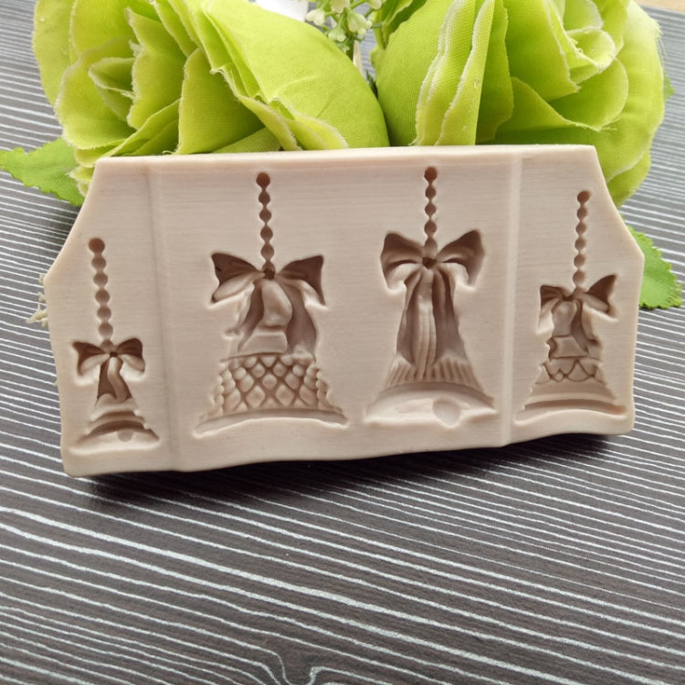 Rectangular Christmas bell silicone mold with multiple embossed bell and bow motifs