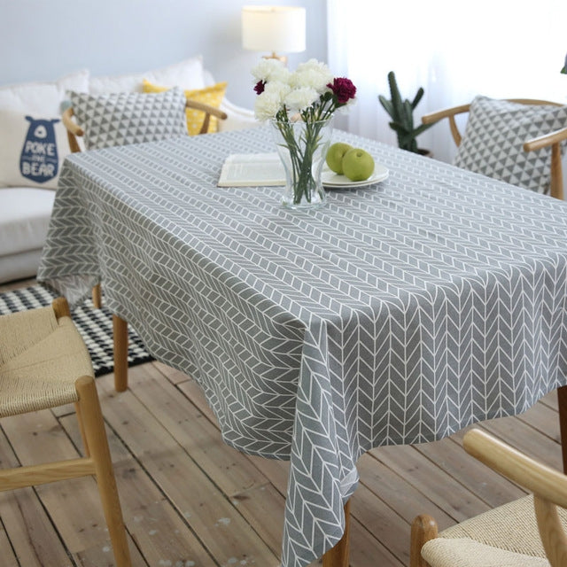 Gray arrow chevron geometric tablecloth with crisp folded edge, cotton-linen blend.