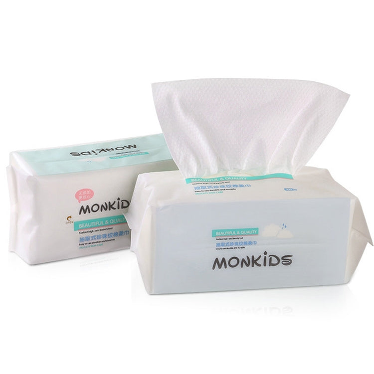 White disposable cotton face towel pack with textured sheets, lying on a white surface