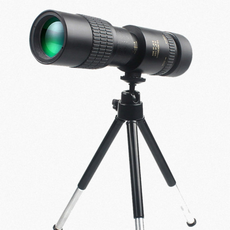 Night vision monocular mounted on tripod with green-tinted front lens