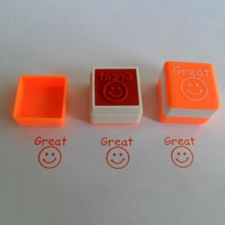 Three orange-toned square teacher comment stamps with “Great” smile design