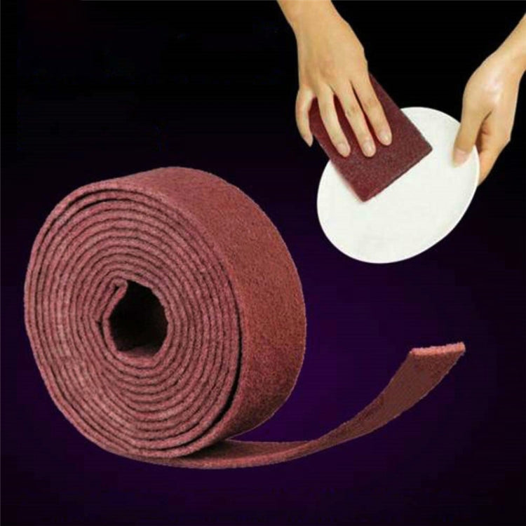 Maroon emery scouring pad roll with hands holding a flat scouring sheet