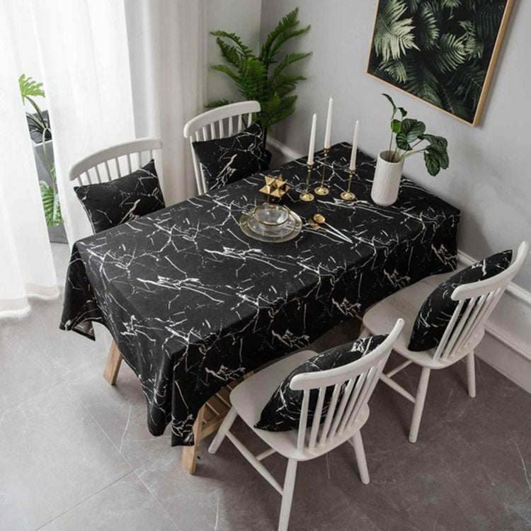 Black marble-pattern tablecloth with fitted-looking top and overhanging edges