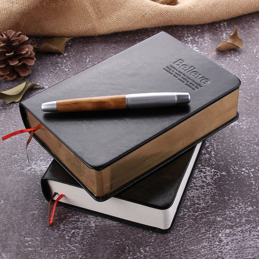 Ultra-thick faux leather notebook, gray cover with black border, gold-toned sides.