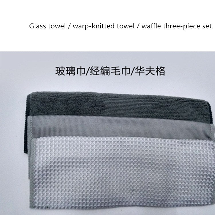 Gray and white waffle-textured glass cleaning cloth with folded edge