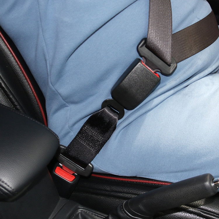 Car seat belt extender buckled on car seat with black straps and red release tab