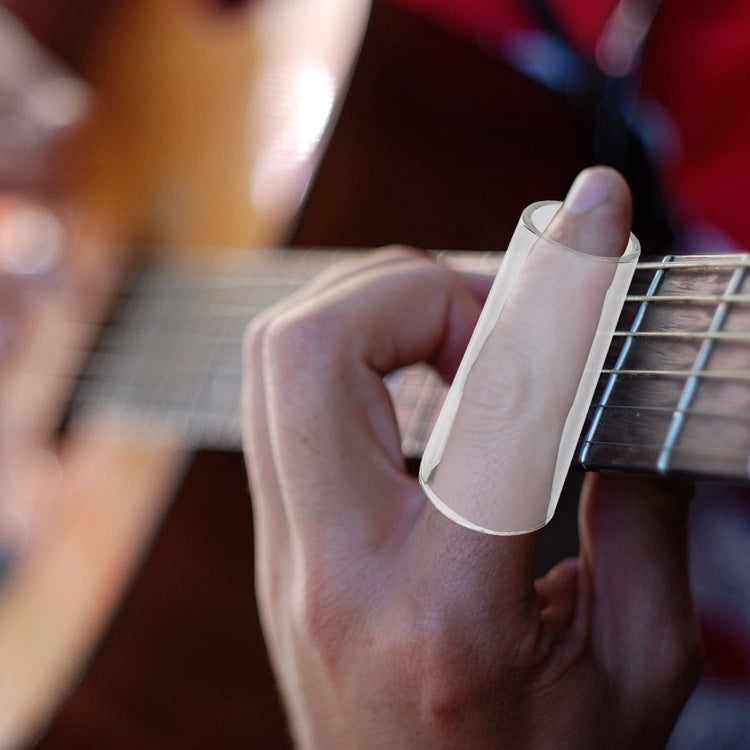 Hand wearing a transparent acrylic guitar slide on the fretboard