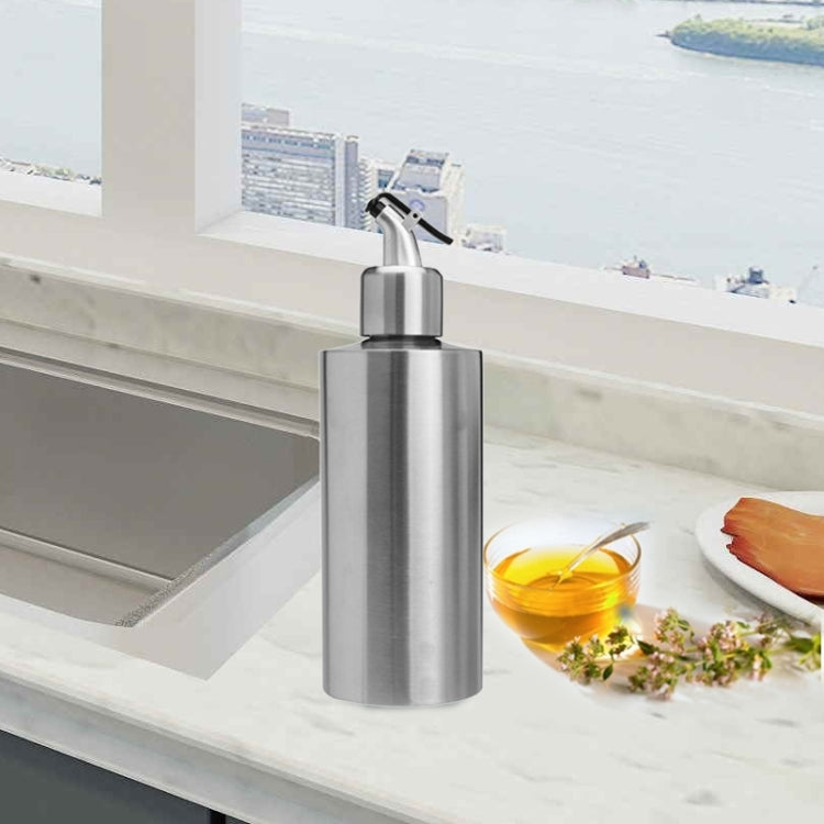 Stainless steel oil sprayer bottle with trigger-style pump nozzle on top
