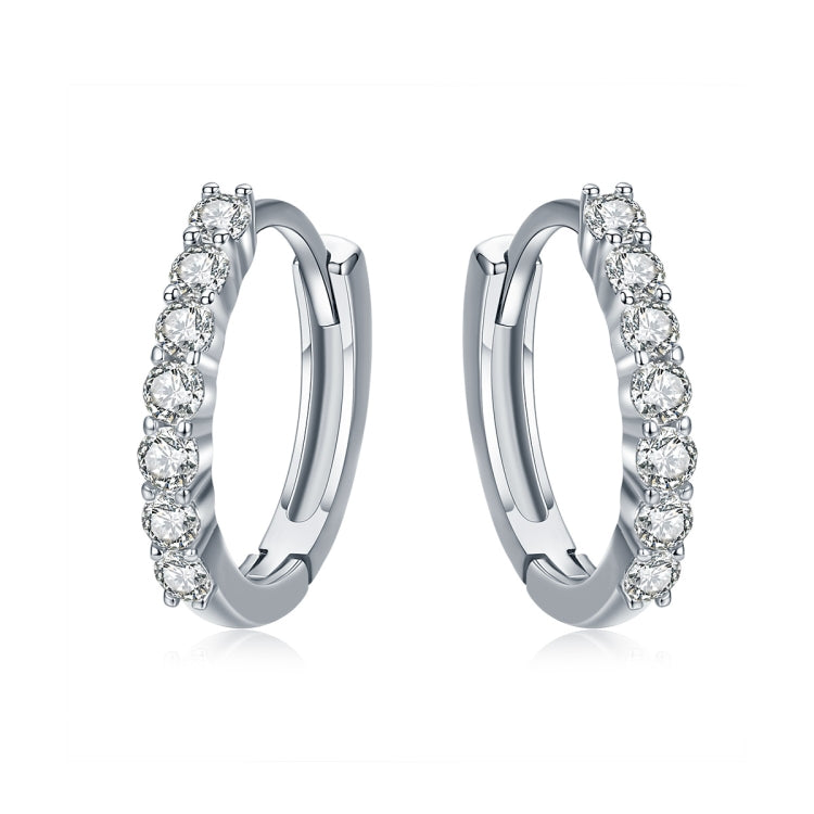 Silver hoop earrings with round zircon-like stones along the hoop edge