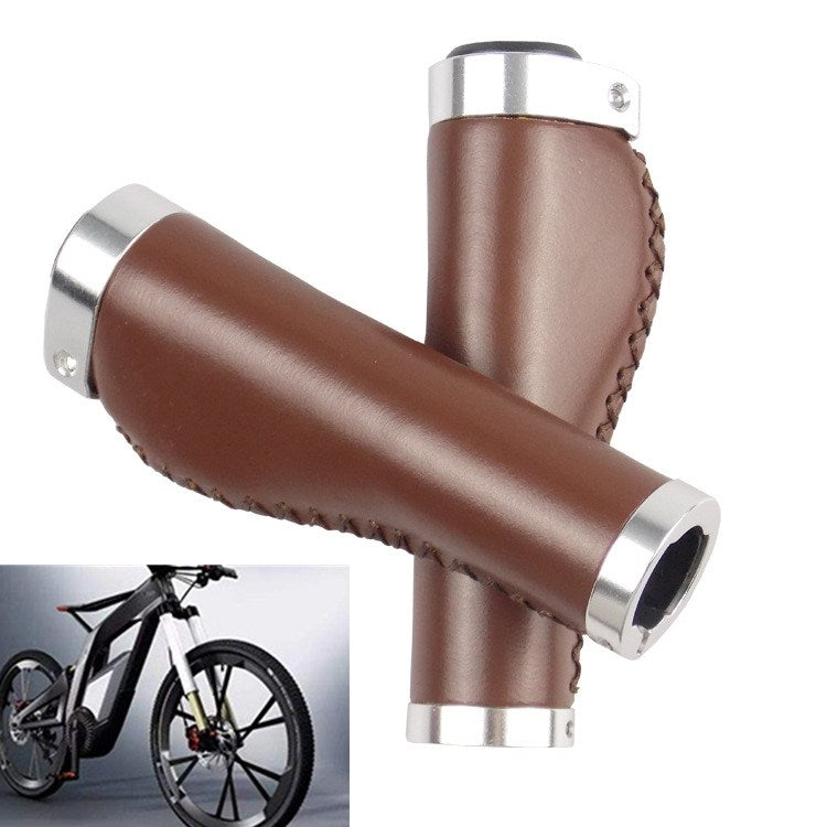 Brown leather bicycle grip cover with stitched seam at joint and silver metal ends.