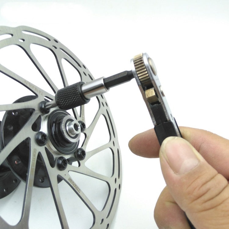 Ratchet wrench used on bicycle brake rotor with hand tightening motion