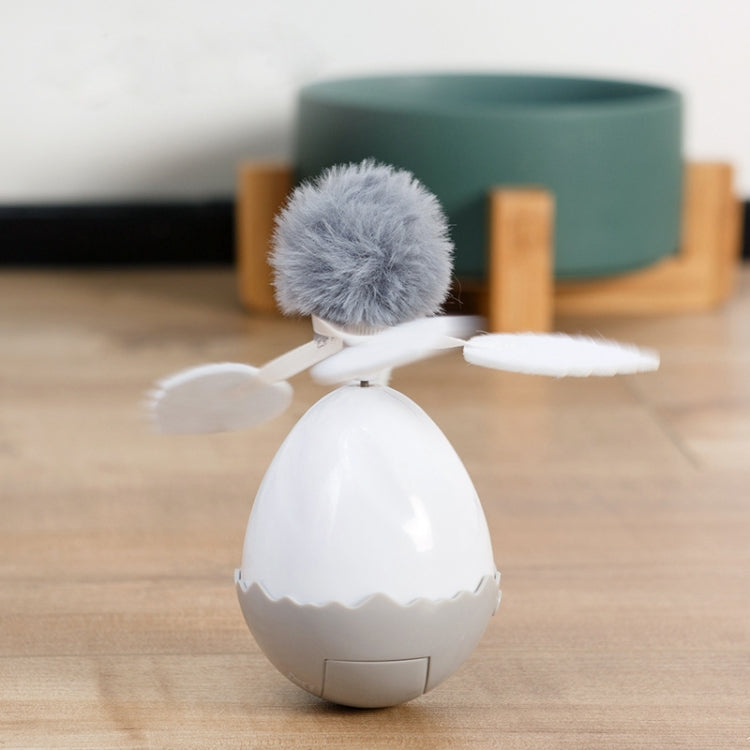 White electric cat egg toy with gray fuzzy pom‑pom and feather arms