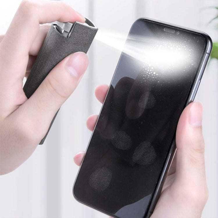 Portable screen cleaning spray bottle spraying phone screen with gray cloth