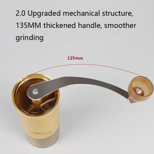 Portable hand-cranked coffee grinder with crank handle and transparent grinding chamber
