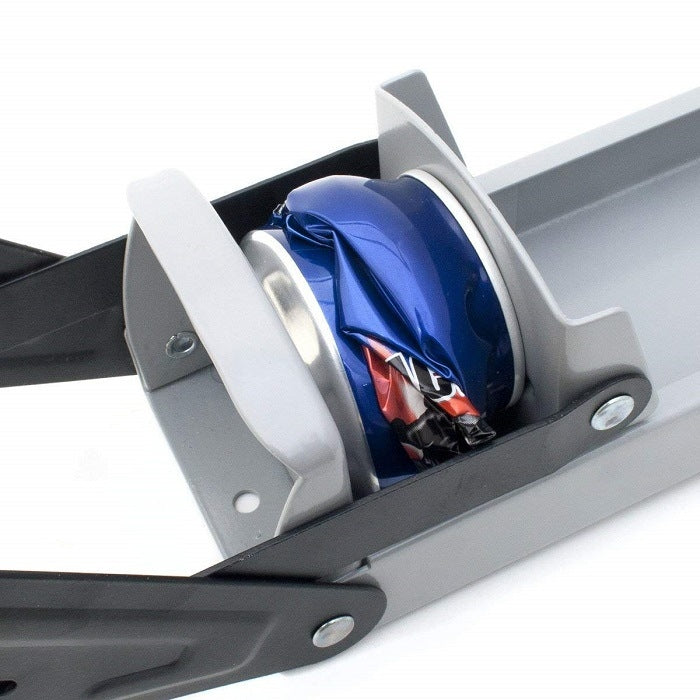 Can crusher mechanism closeup with gray lever bar pressing a blue can