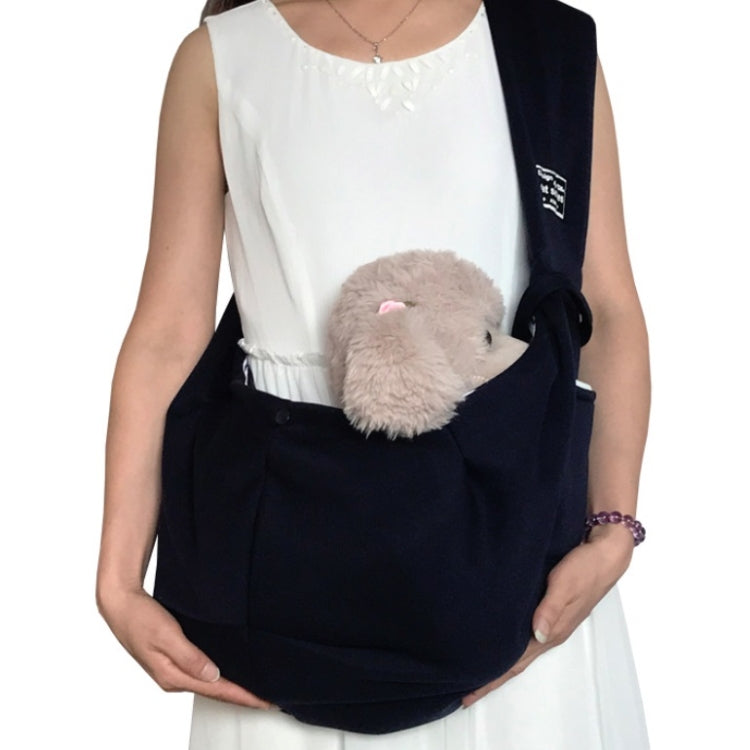 Pet outing carrier bag, dark with front pouch holding a small pet