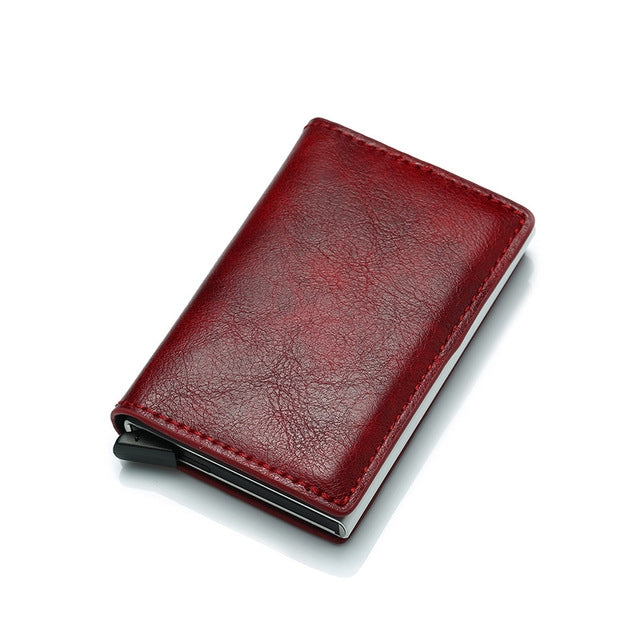 Red leather card wallet with elastic closure and metal card holder