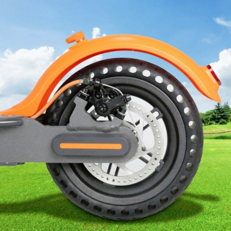 Electric scooter wheel with disc brake rotor, silver slotted rotor on the axle