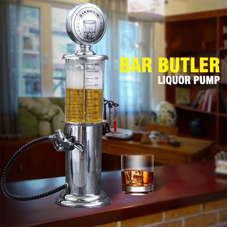 Stainless steel wine dispenser with glass cylinder and spigot on countertop