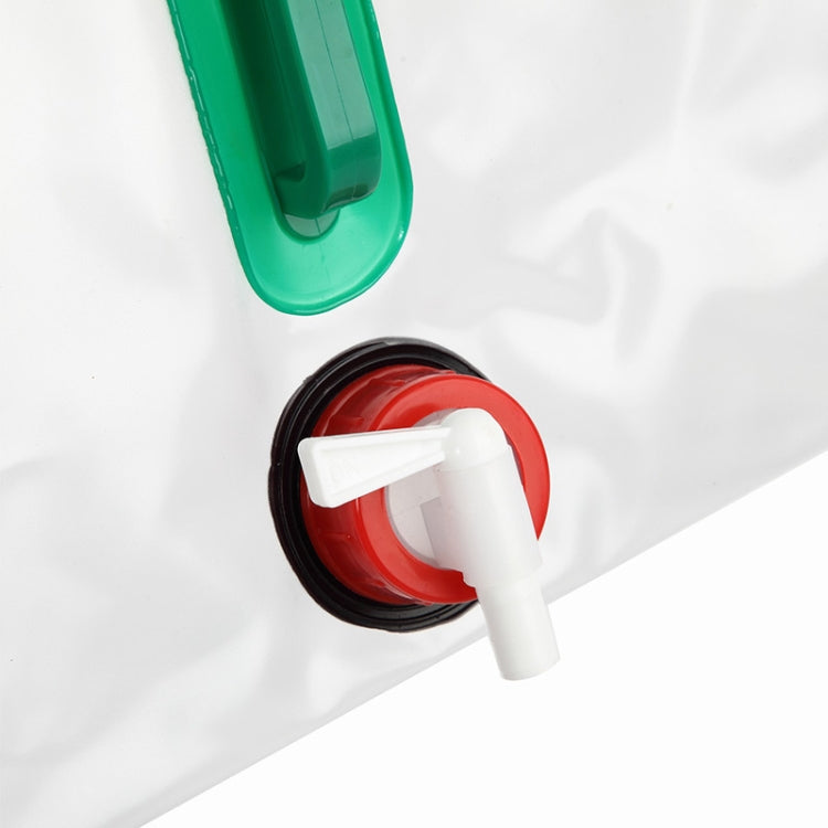 Close-up transparent 20L water bag spigot with red valve and green handle