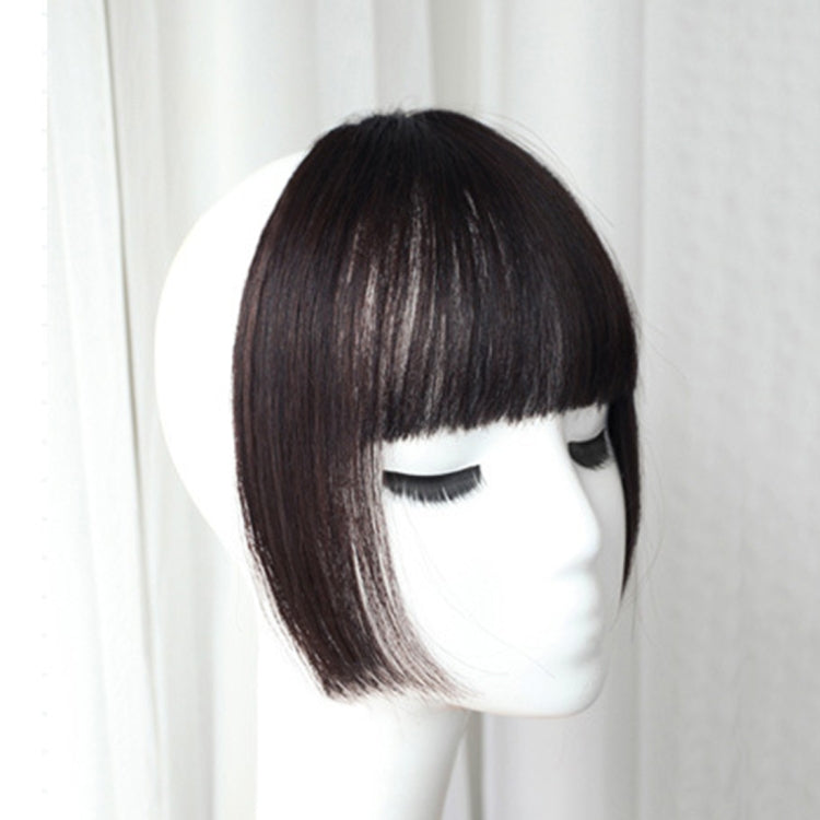 Black clip-in bangs hair extensions with blunt straight fringe, shown on mannequin head