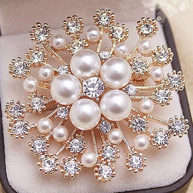 Rose-gold snowflake brooch pin with large faux-pearl drops and clear crystal accents