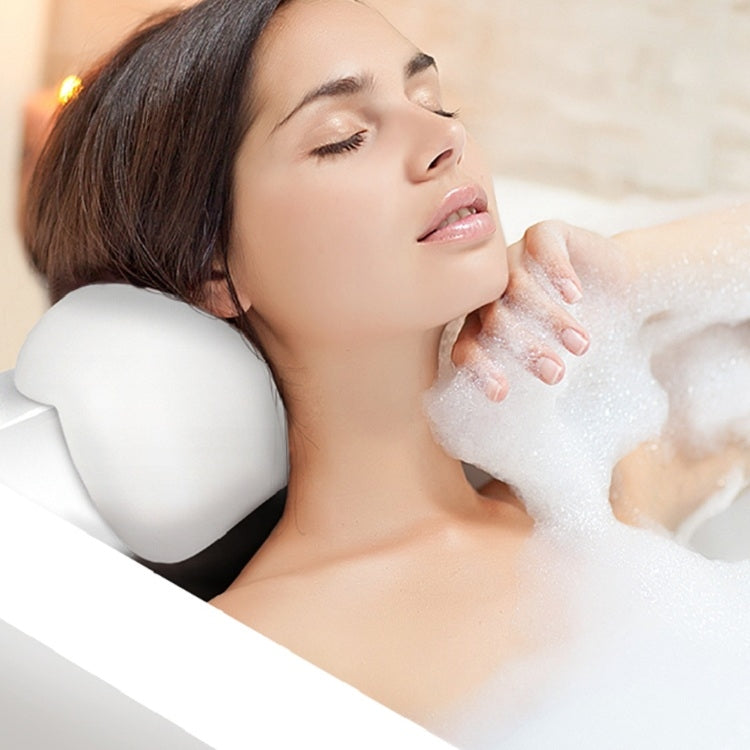 White massage bathtub pillow under the head during a bath