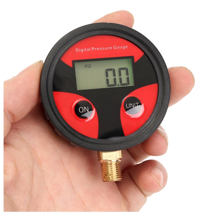Digital tire pressure gauge in hand with LCD reading and ON/UNIT buttons