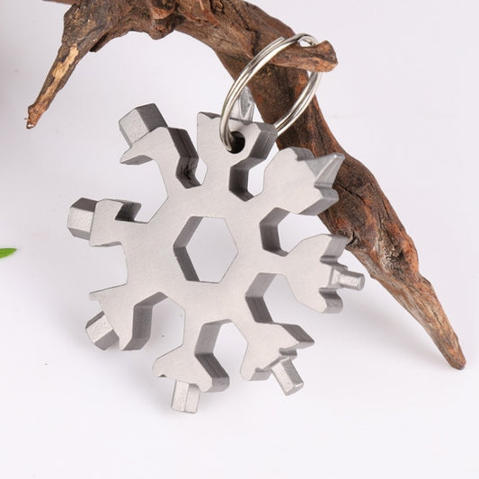 Snowflake multi-tool with keyring loop and multi-wrench tips, light gray