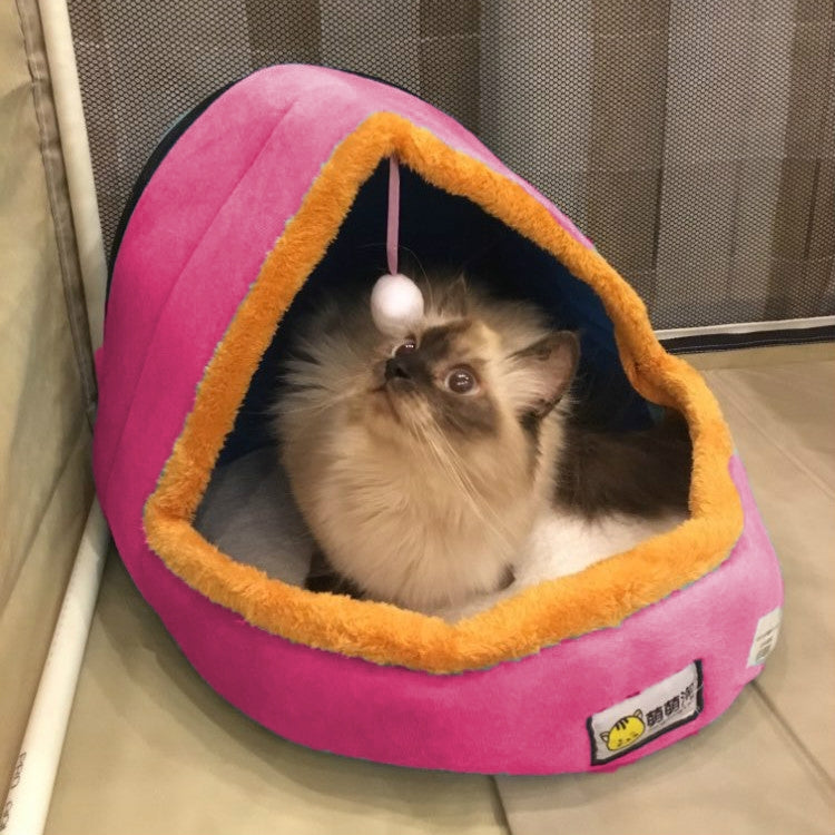 Pink plush pet tent bed with cozy cave opening and hanging toy ball