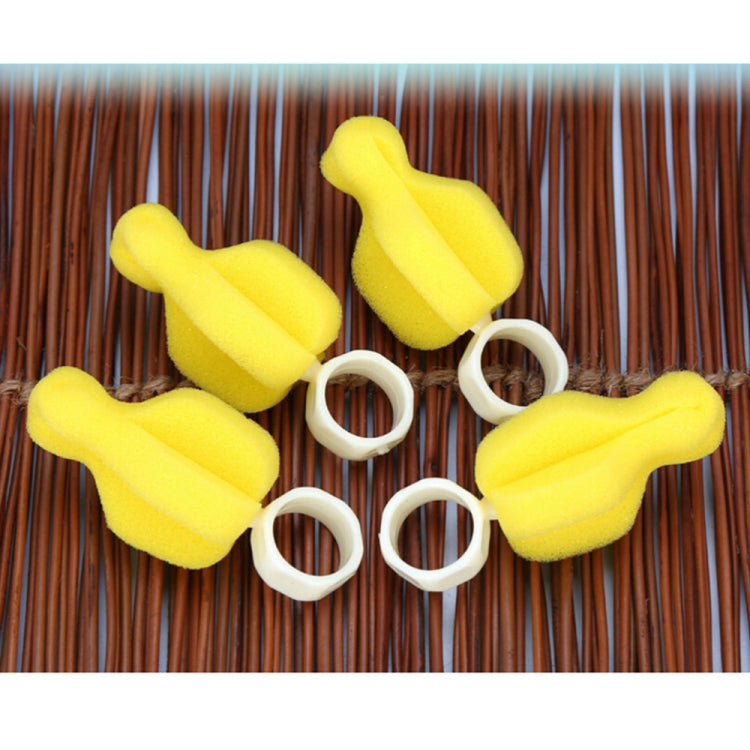 Five yellow sponge brushes with white ring handles laid out for baby bottle and pacifier cleaning