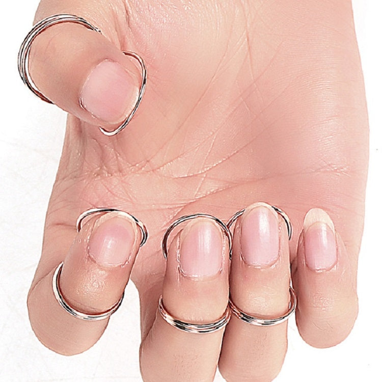 Fingers wearing metal spring ring guitar picks, close-up