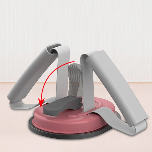 Indoor sit-up aid with pink base, gray leg support, and curved grip pads