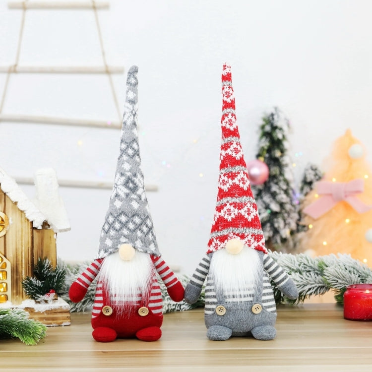 Two plush faceless elderly doll ornaments on display with gray and red long hats