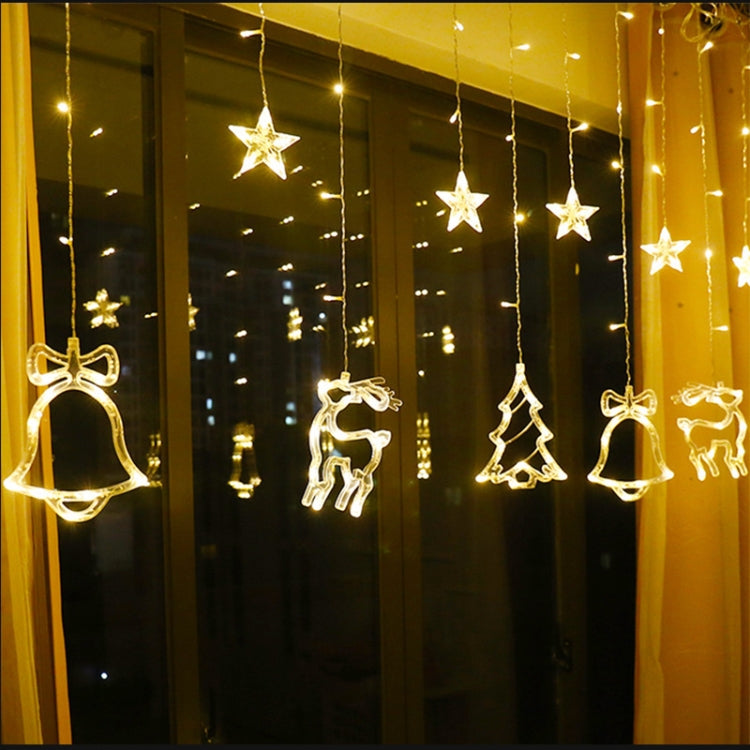 LED curtain string lights with star, bell, deer and tree ornaments hanging on strands