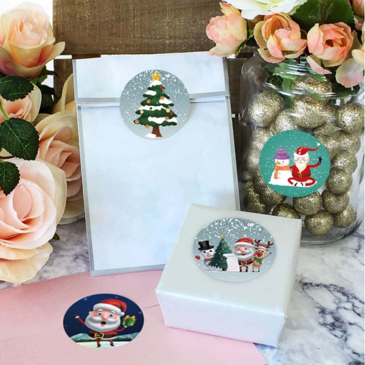 Circular Christmas sticker with tree design on gift box, plus assorted stickers